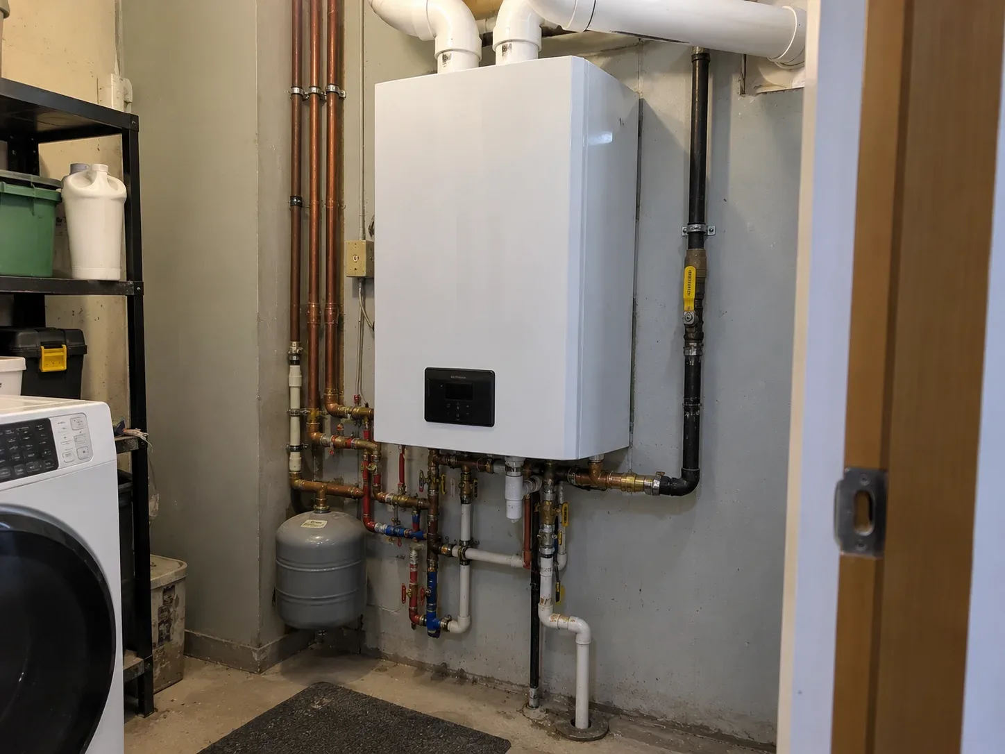 Wall-mounted combi boiler installed in a Kitchener home